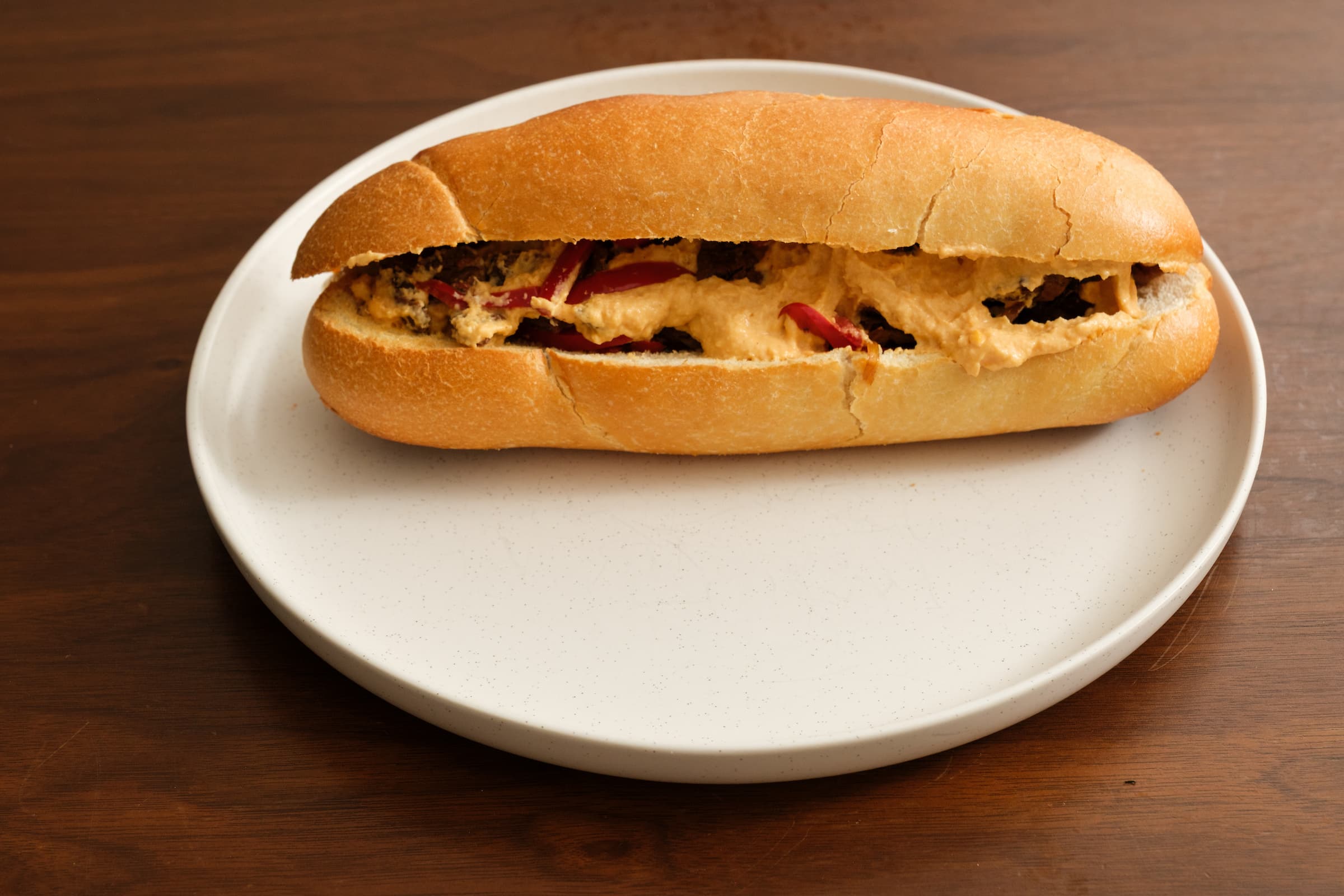 Vegan Philly Cheesesteak plated on a white dish